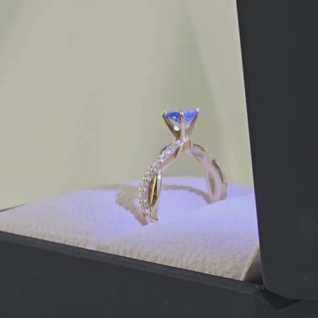 Anillo de Compromiso "Luz Infinita" en oro de 18K con gema azul-violeta - Peruviana